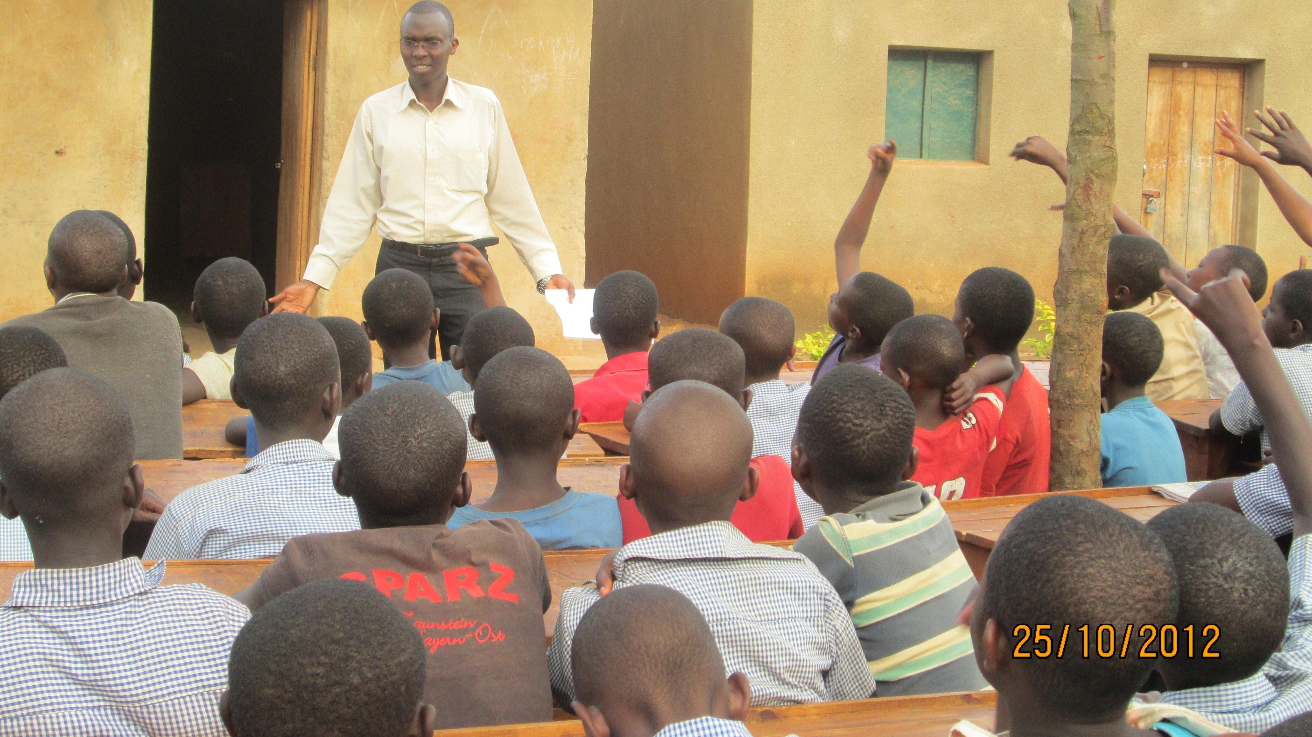 Pax Remy Pacifique addressing pupils at Nkondo primary school